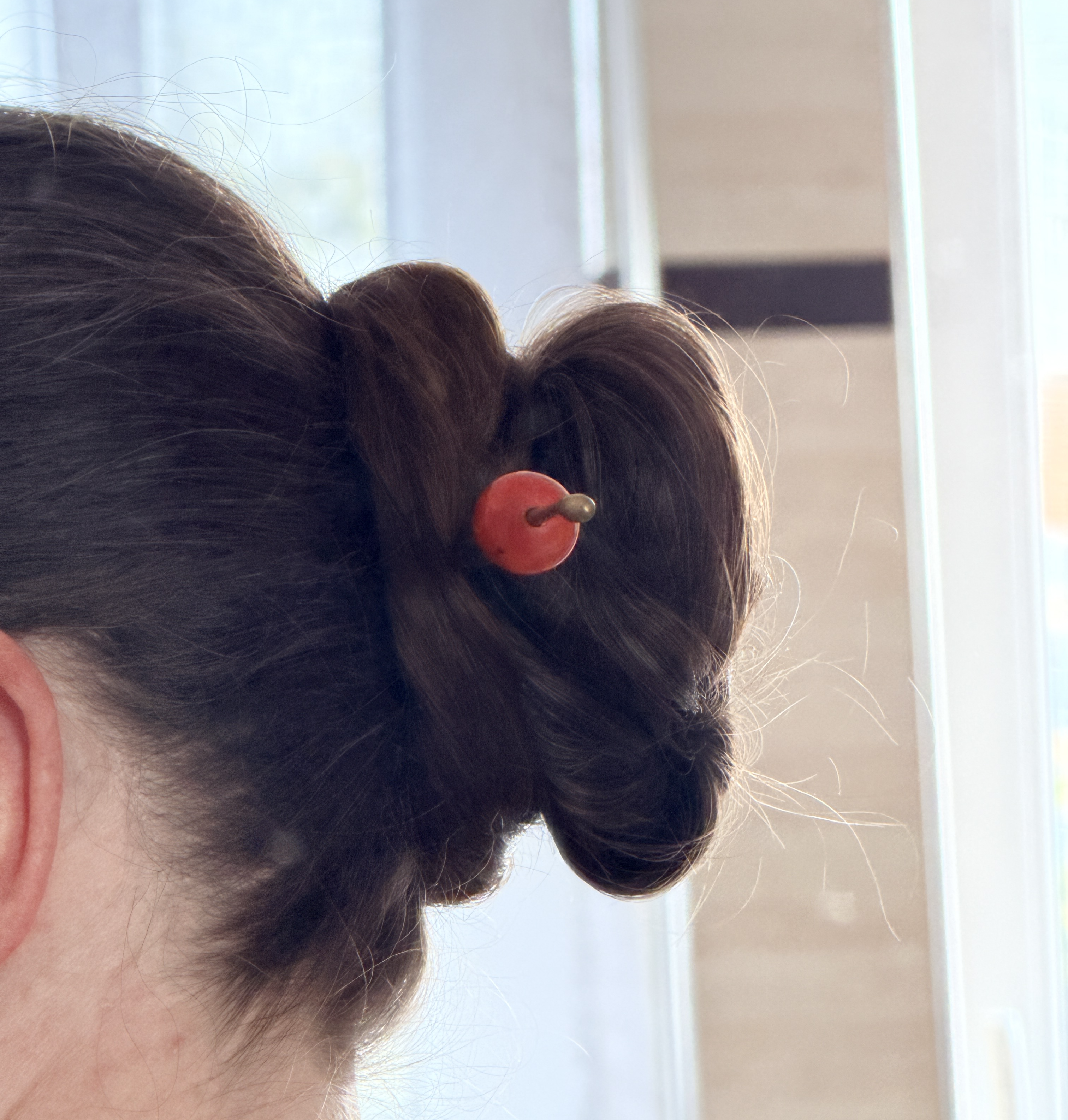 Holding my hair up with a traditional Japanese tamakanzashii, a hair stick.