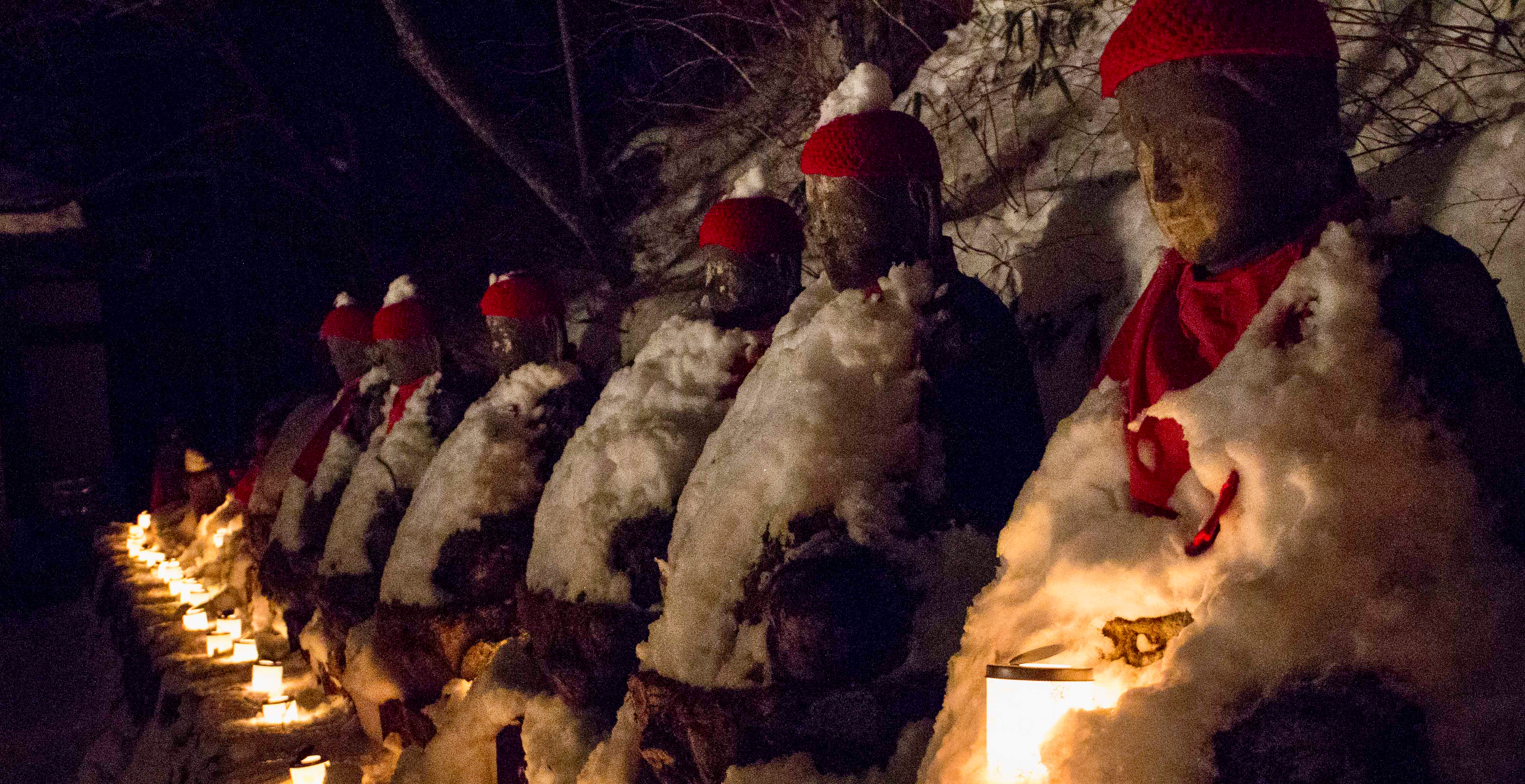 The mid-winter lantern festival in Nikko, with the stone carved jizo statues in their red hats all holding their own lantern