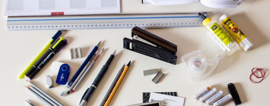 A collection of common office supplies on a desk
